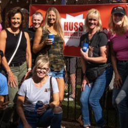 Group shot with Huss Brewing Banner